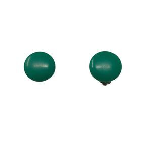 Simple and stylish, these vintage clip-on button earrings feature a bold matte